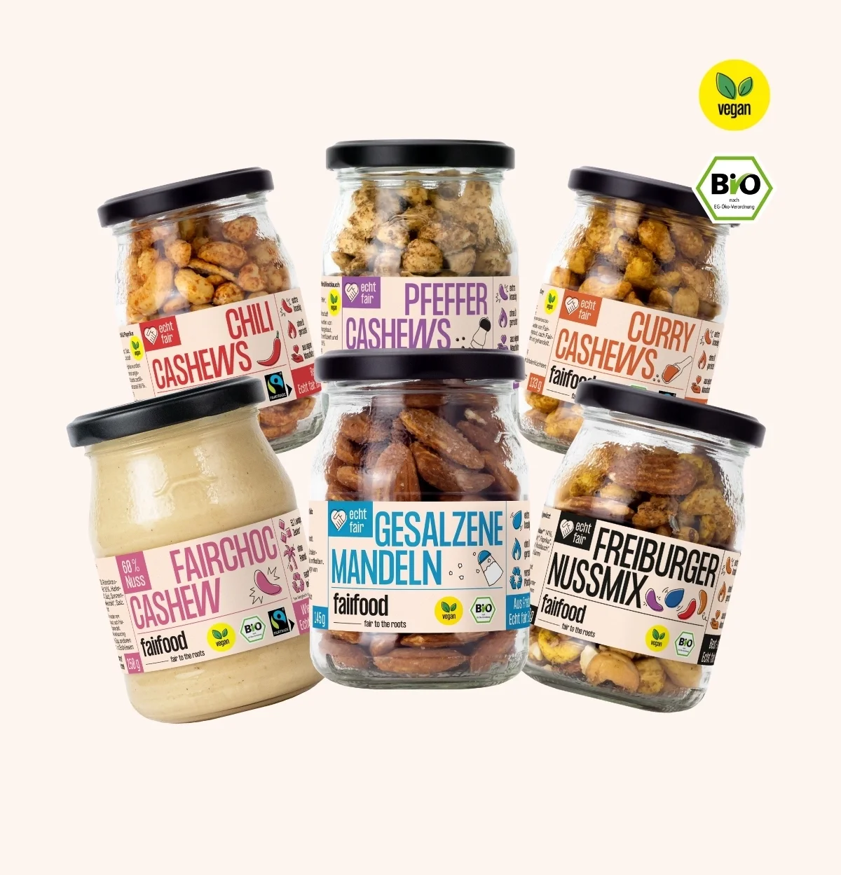 sechs Pfandglaeser mit Nuessen und Schokocreme