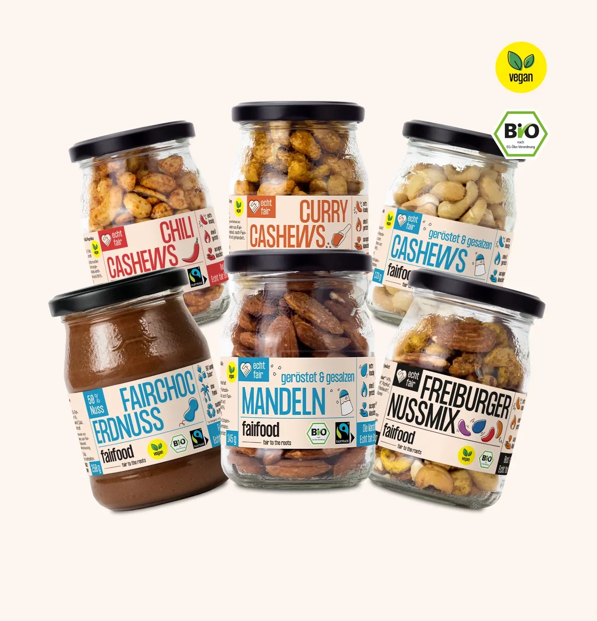 sechs Pfandglaeser mit Nuessen und Schokocreme