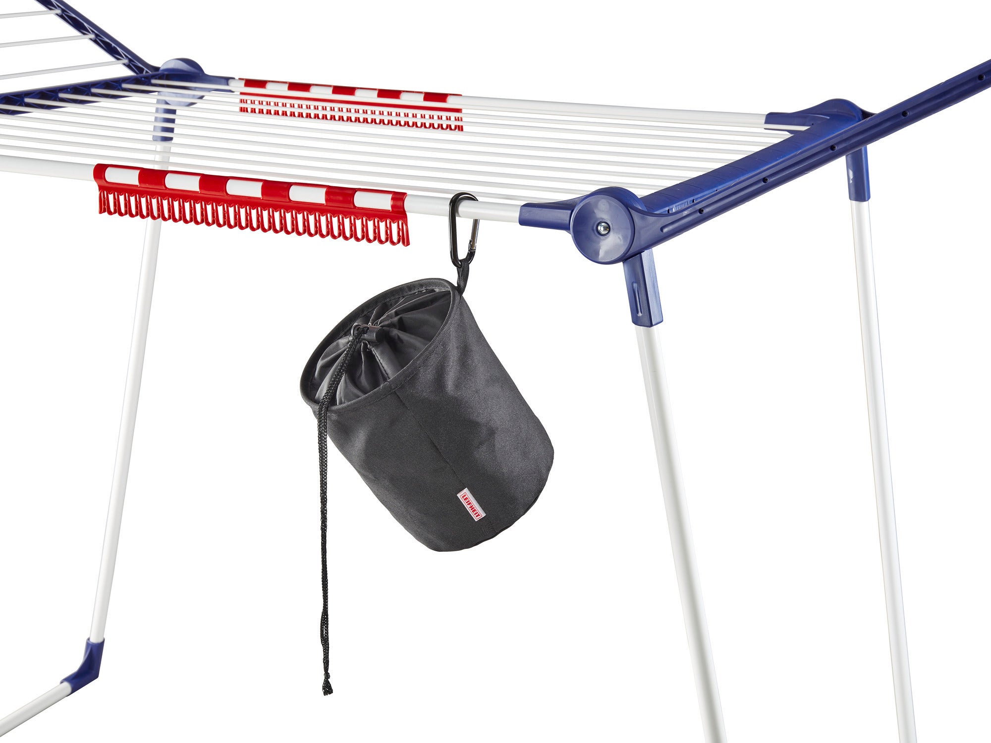 A black clothes peg bag hangs on a clothes horse. The bag is cylindrical and closed with a drawstring. Ideal for storing clothes pegs.