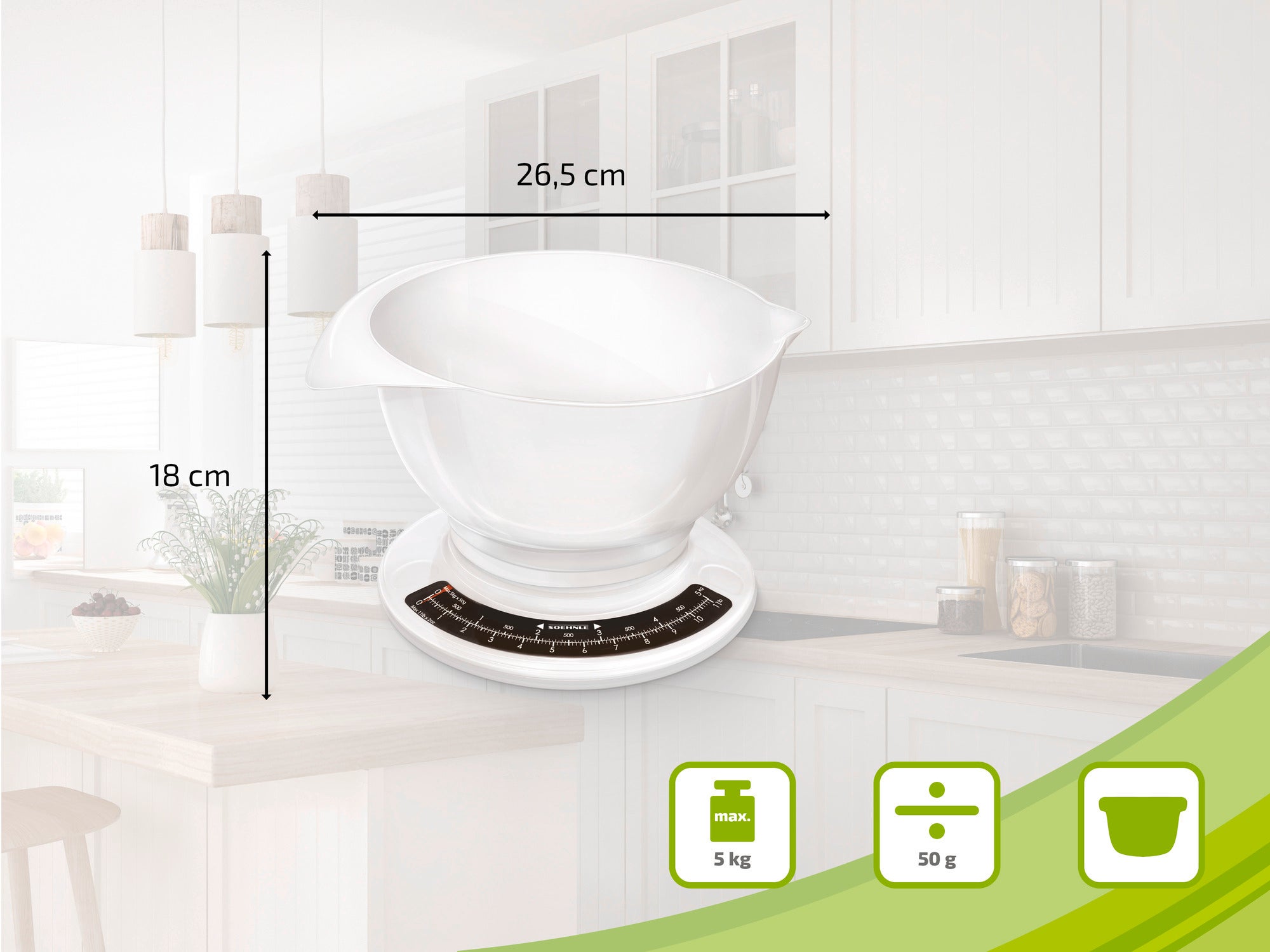 Küchenwaage mit weißer Schüssel, 26,5 cm breit und 18 cm hoch, auf einer Küchenarbeitsplatte. Die Waage hat eine Kapazität von 5 kg und eine Genauigkeit von 50 g.