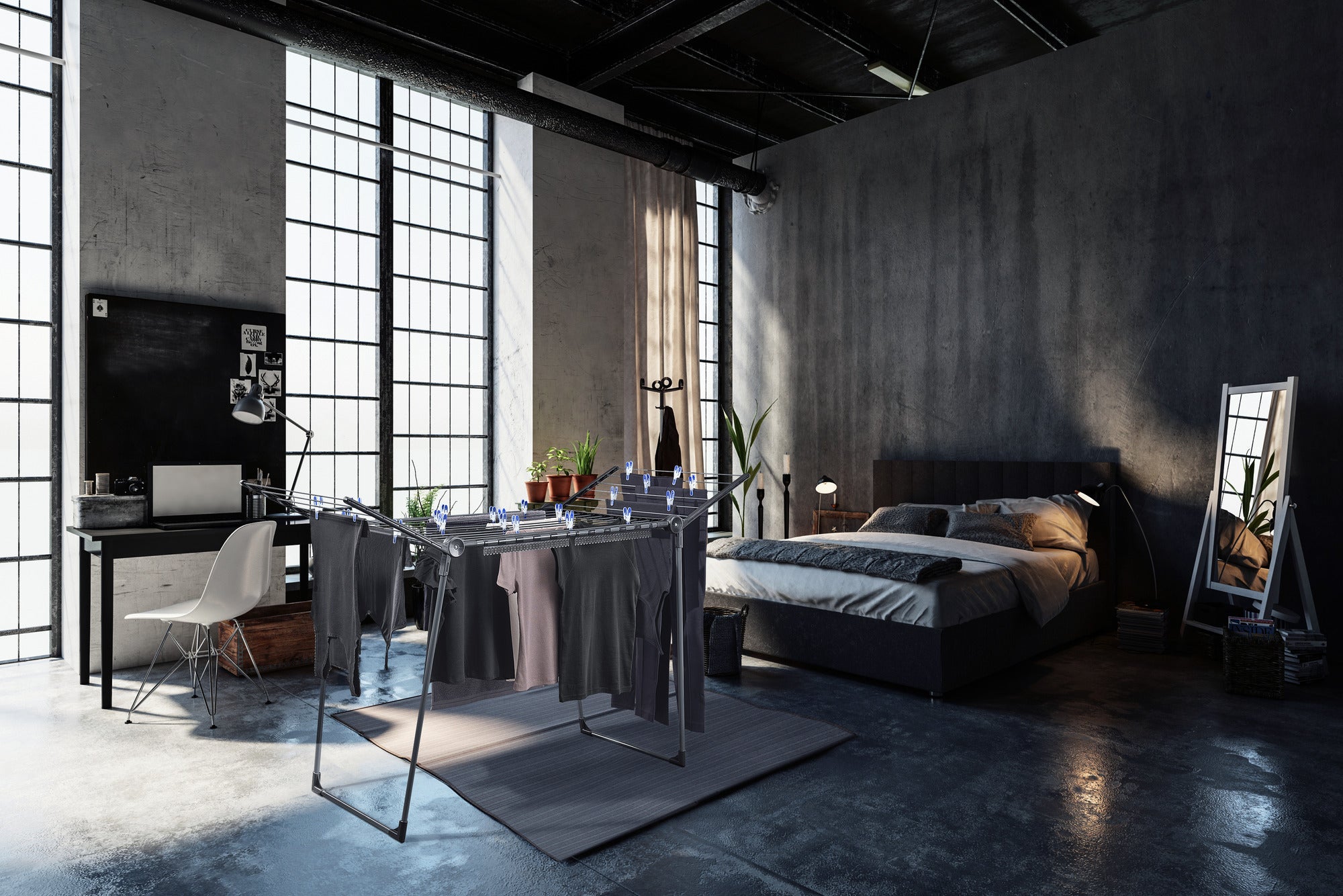 Wolnostojąca suszarka bębnowa Pegasus 180 Solid stoi w nowoczesnej sypialni z dużymi oknami. Suszarka bębnowa jest załadowana ubraniami i harmonijnie wtapia się w stylowe wnętrze.