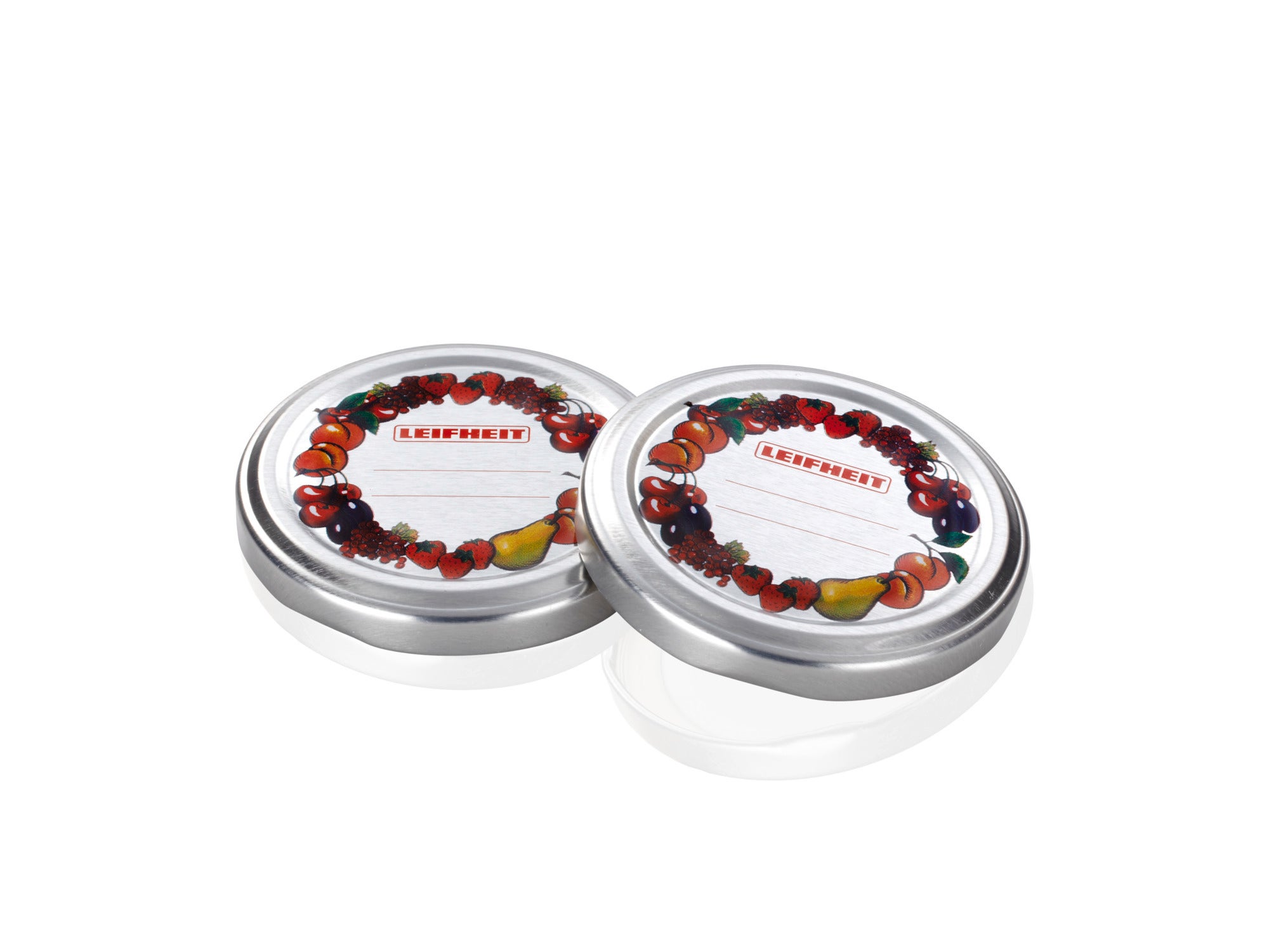 Twee zilveren vervangdeksels met een decoratief fruitpatroon en een etiketveld. Ideaal voor het inmaken van potten om voedsel vers te houden.