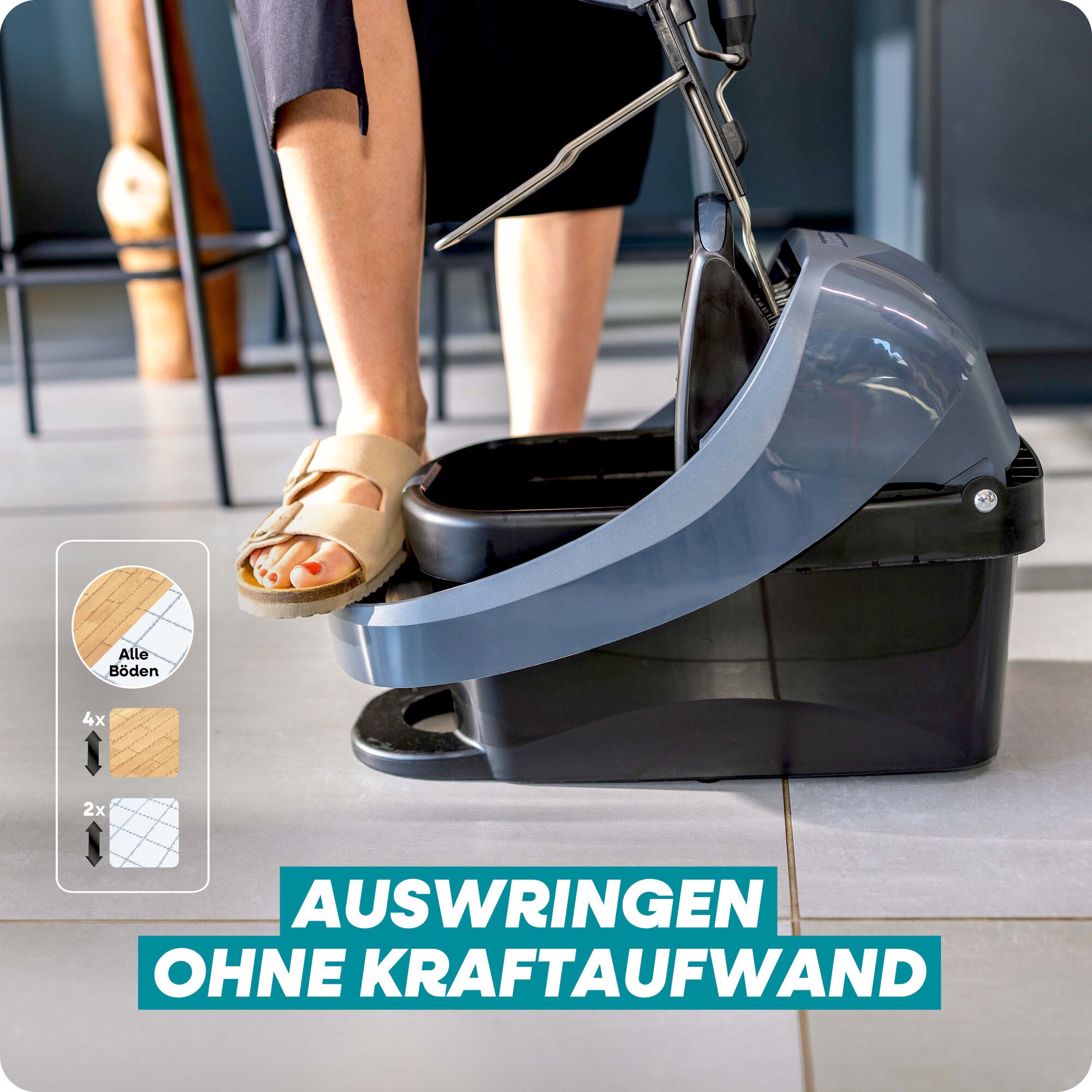 Leifheit Set Profi XL Mobile Black mit Schleudersystem und Rollen, gezeigt beim mühelosen Auswringen des Bodenwischers ohne Kraftaufwand, geeignet für alle Böden im modernen Wohnbereich.