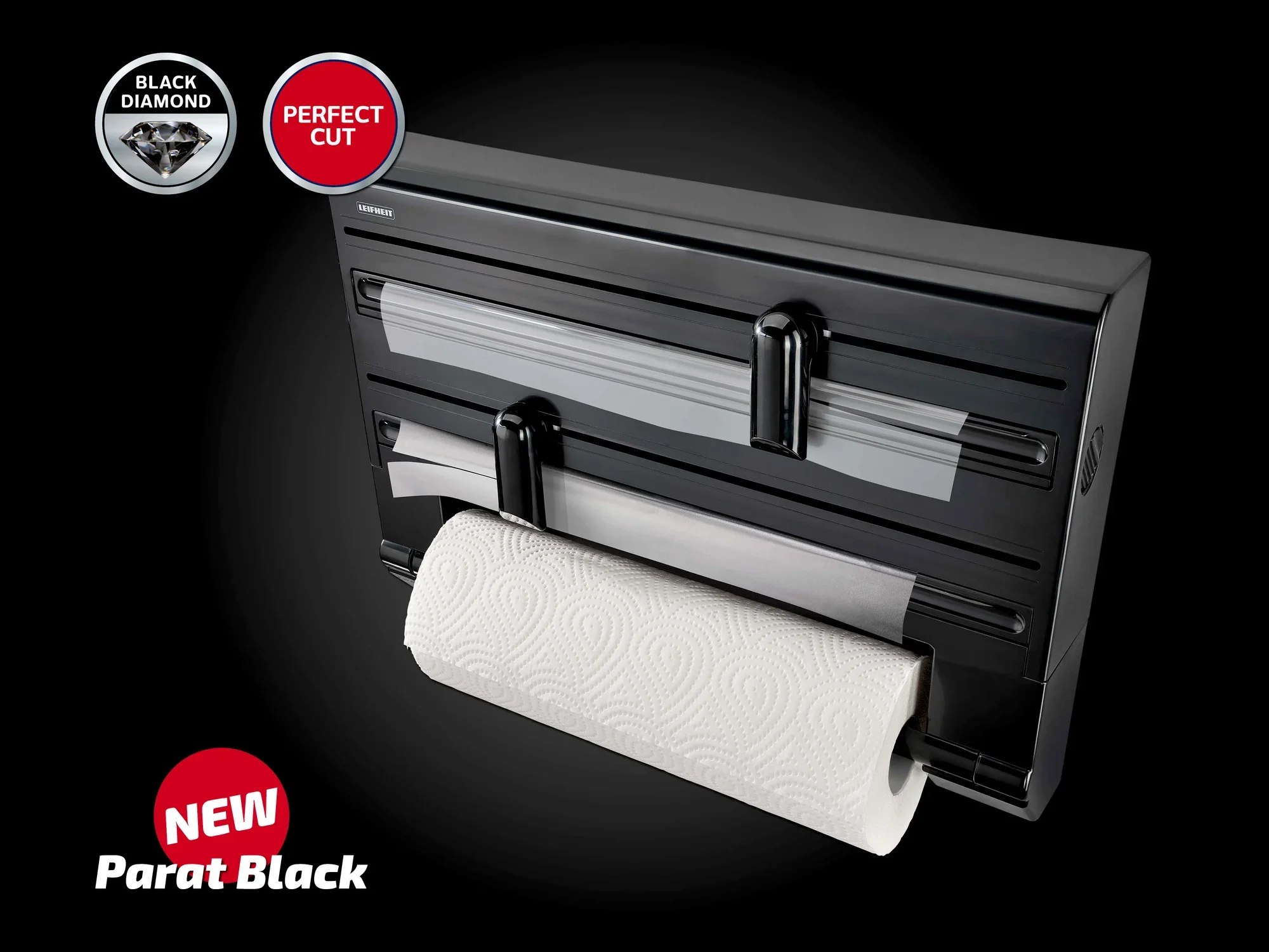 Wandrollenhalter Parat Black von Leifheit in elegantem Schwarz. Der Halter bietet Platz für drei Rollen und ermöglicht ein einfaches Abreißen dank der scharfen Klingen. Ideal für Küche und Haushalt.