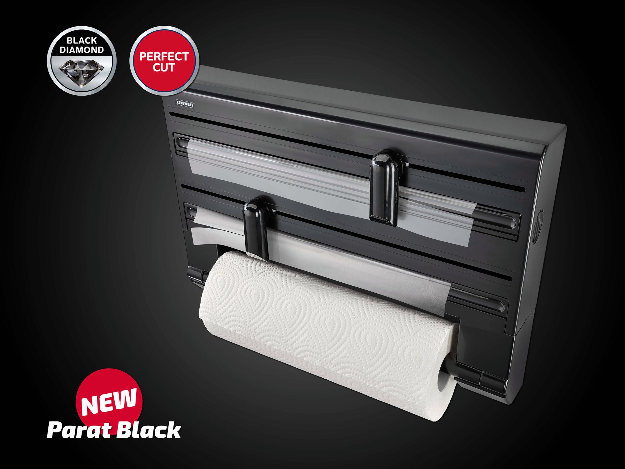 Wandrollenhalter Parat Black von Leifheit in elegantem Schwarz. Der Halter bietet Platz für drei Rollen und ermöglicht ein einfaches Abreißen dank der scharfen Klingen. Ideal für Küche und Haushalt.