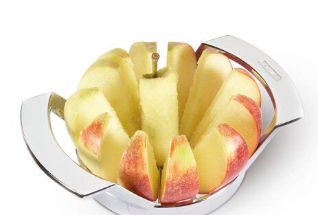 An apple slicer divides an apple into even slices. The stainless steel frame ensures precise cutting while the core is removed cleanly. Ideal for quick snacks.