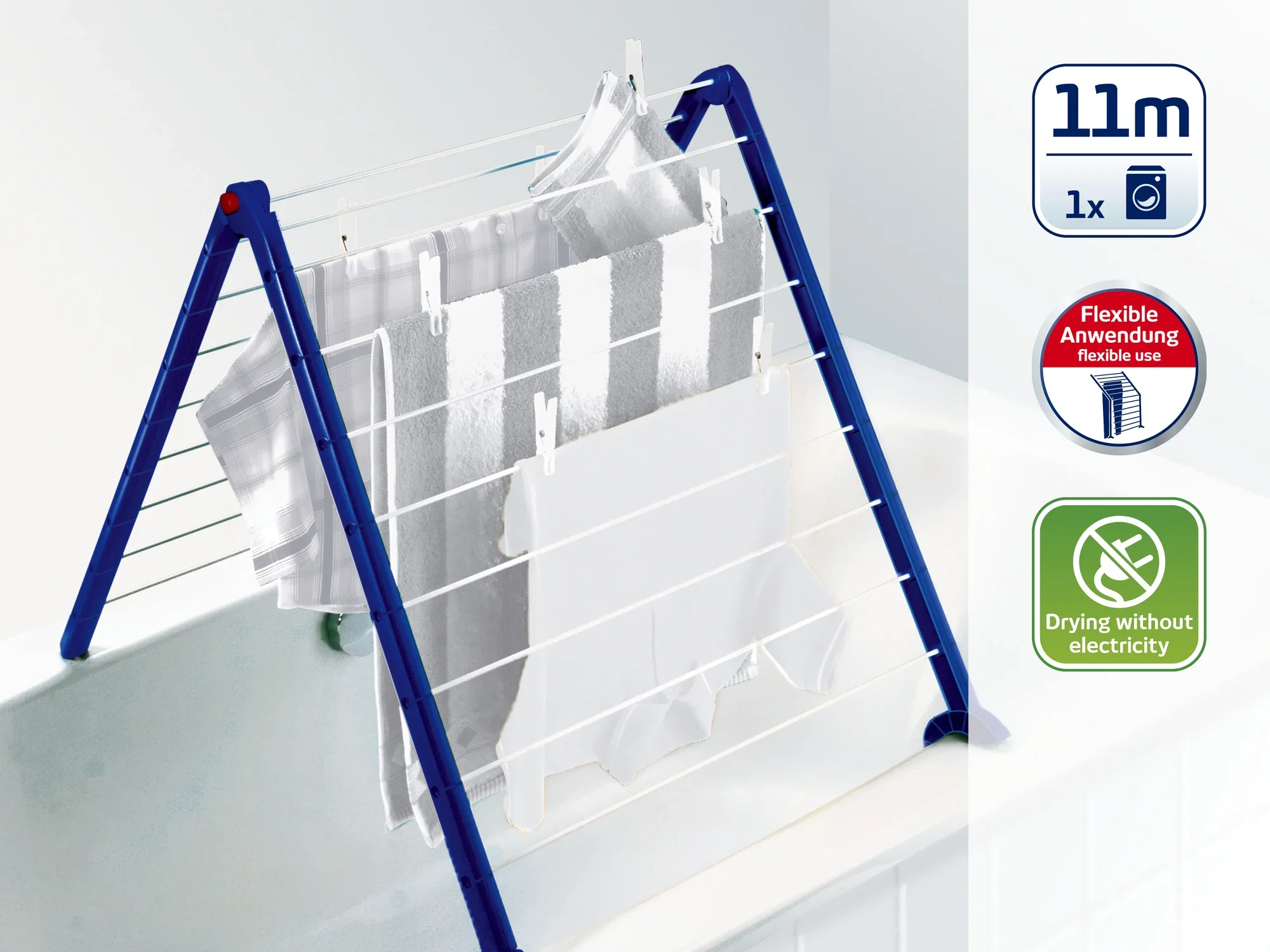Suszarka stojąca na wannie. Ma niebieską ramę i białe linie, na których wiszą ręczniki. Symbole wskazują 11 metrów długości suszenia i elastyczne zastosowanie.