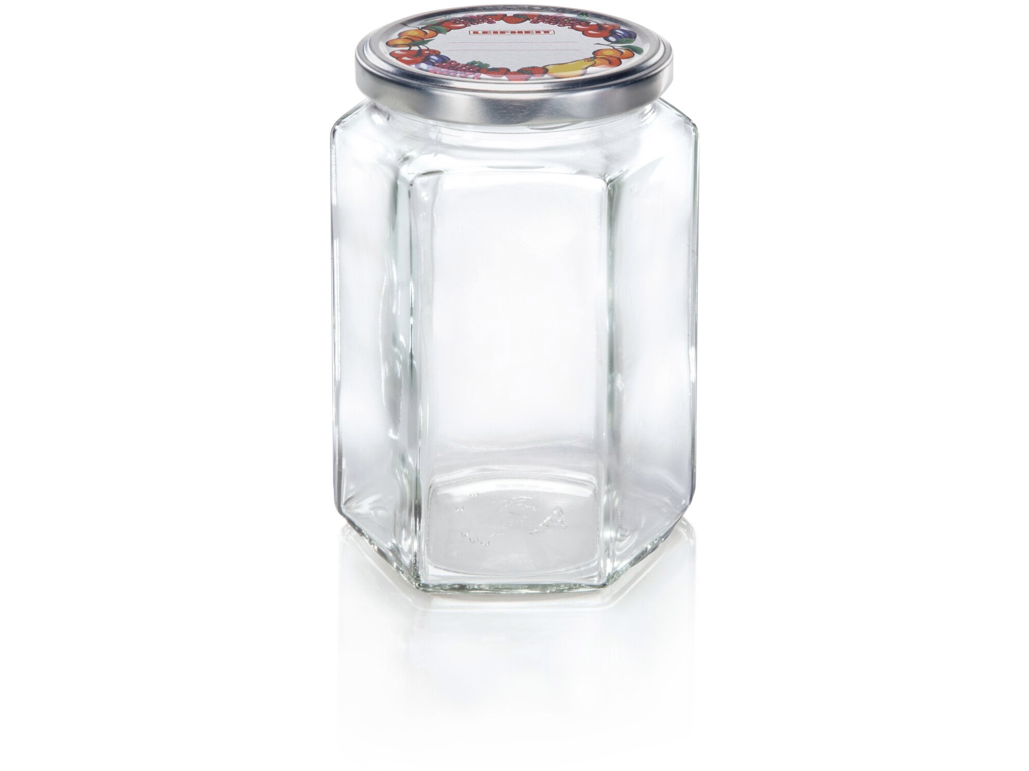 Tarro de vidrio hexagonal de 770 ml con tapa metálica decorativa. Ideal para almacenar conservas o alimentos. Diseño elegante y funcional para cualquier cocina.