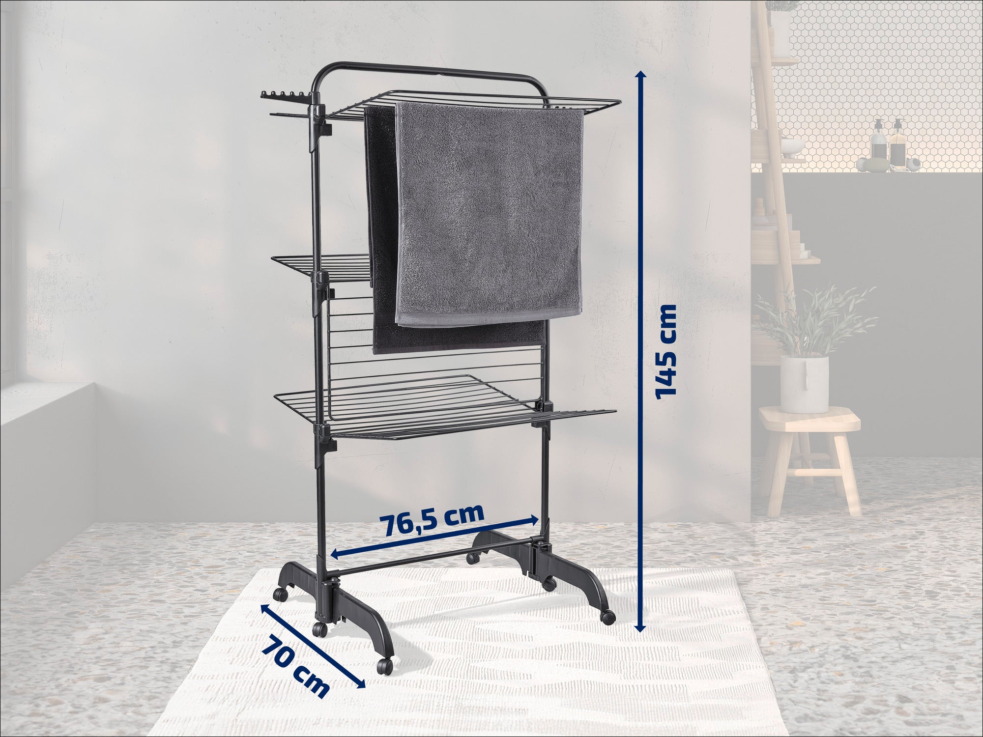 A three-tier tower dryer, ideal for drying clothes. It measures 145 cm in height, 76.5 cm in width and 70 cm in depth. Perfect for small spaces.