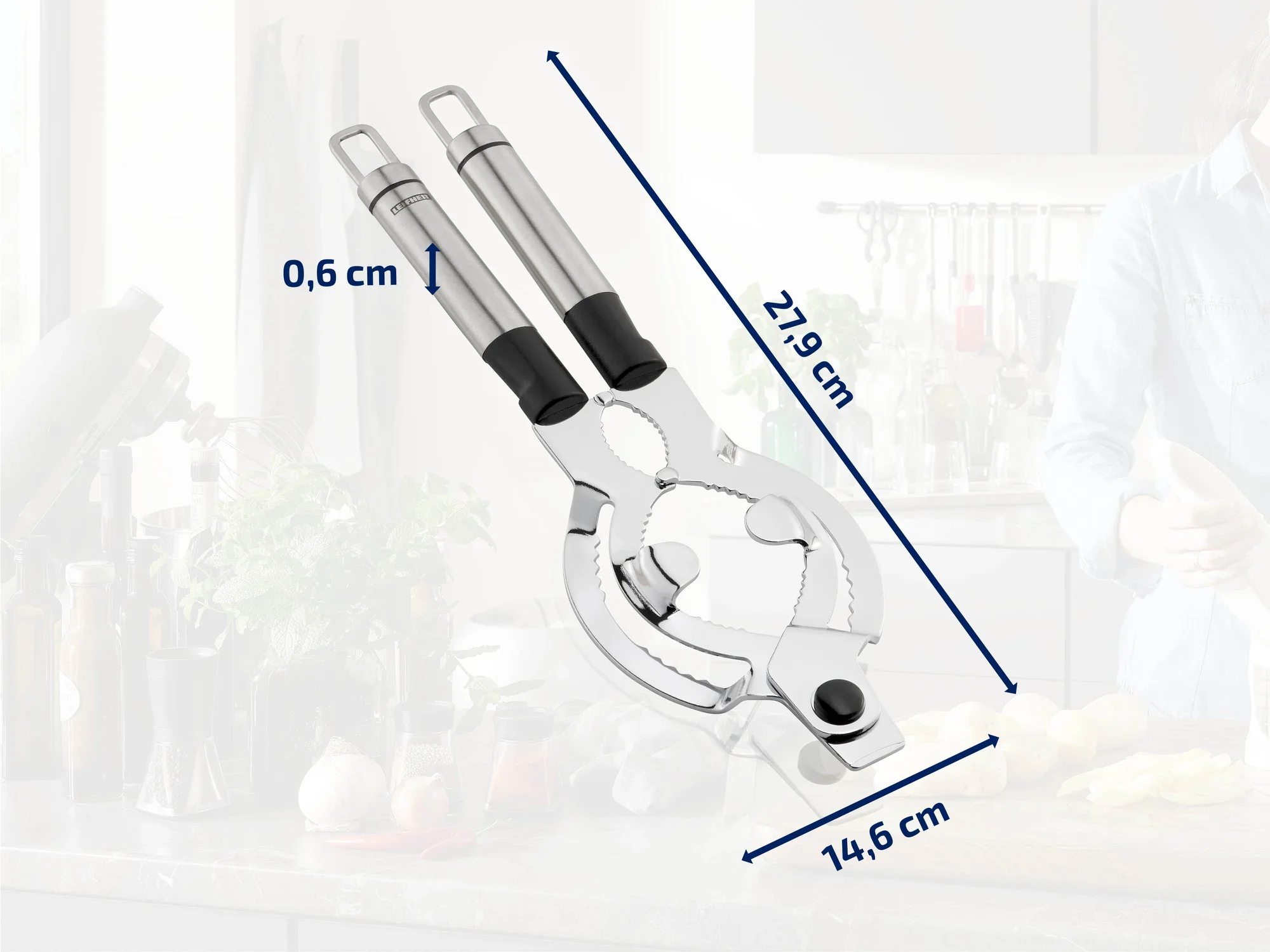 Stainless steel nutcracker with ergonomic handles, 21.9 cm long and 14.6 cm wide. Ideal for cracking nuts in the kitchen. Background shows a modern kitchen.