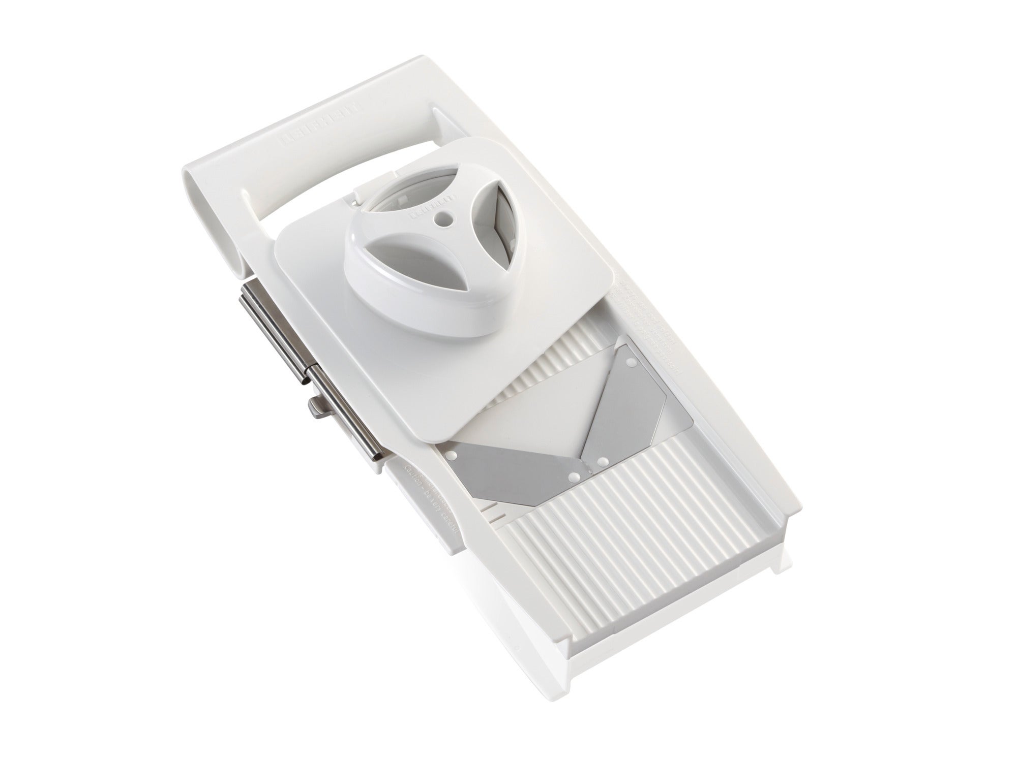 Râpe multifonctionnelle 4+1 en plastique blanc avec poignée ergonomique. Idéale pour râper divers aliments avec précision et sécurité. Design moderne et pratique.