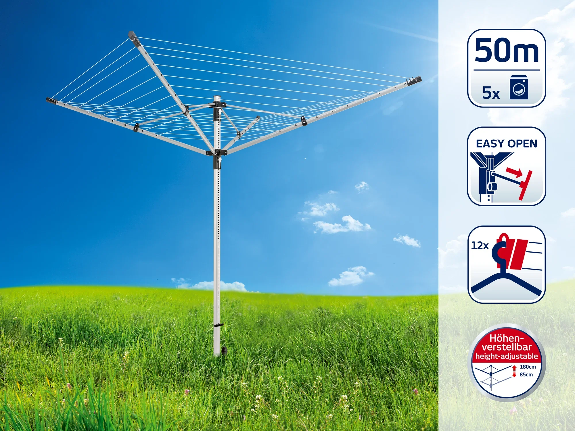 A rotary clothes dryer stands on a green lawn under a blue sky. It offers 50 metres of line length, is height-adjustable and easy to open. Ideal for up to 5 loads of laundry.