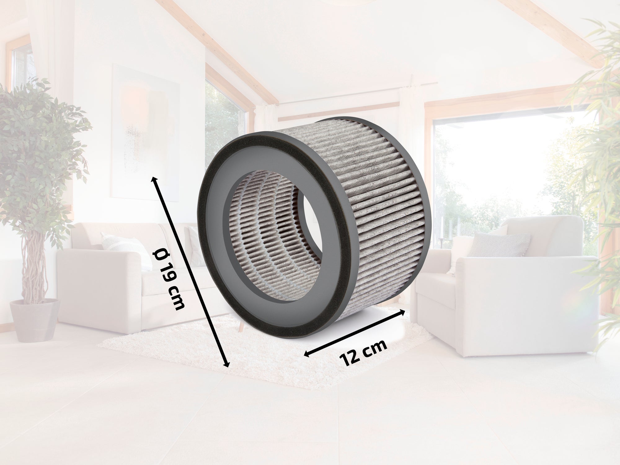 A cylindrical air filter measuring 19 cm in diameter and 12 cm in height is displayed in a modern living room. The filter is centrally placed and surrounded by light-coloured furniture.