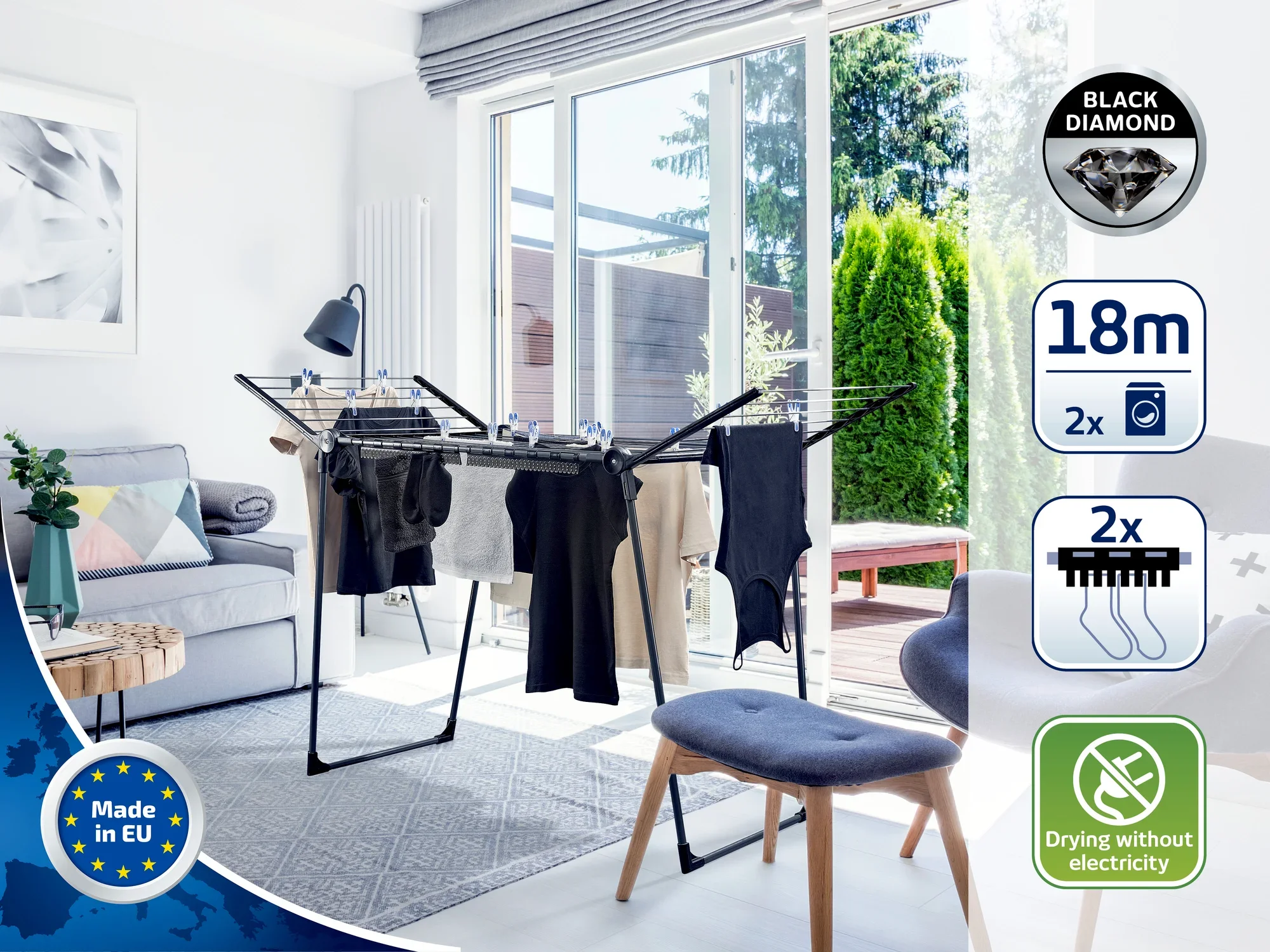 Nowoczesna wolnostojąca suszarka bębnowa w jasnym salonie otoczonym dużymi oknami. Suszarka pomieści 18 metrów prania i jest idealna do ekologicznego suszenia bez użycia prądu.