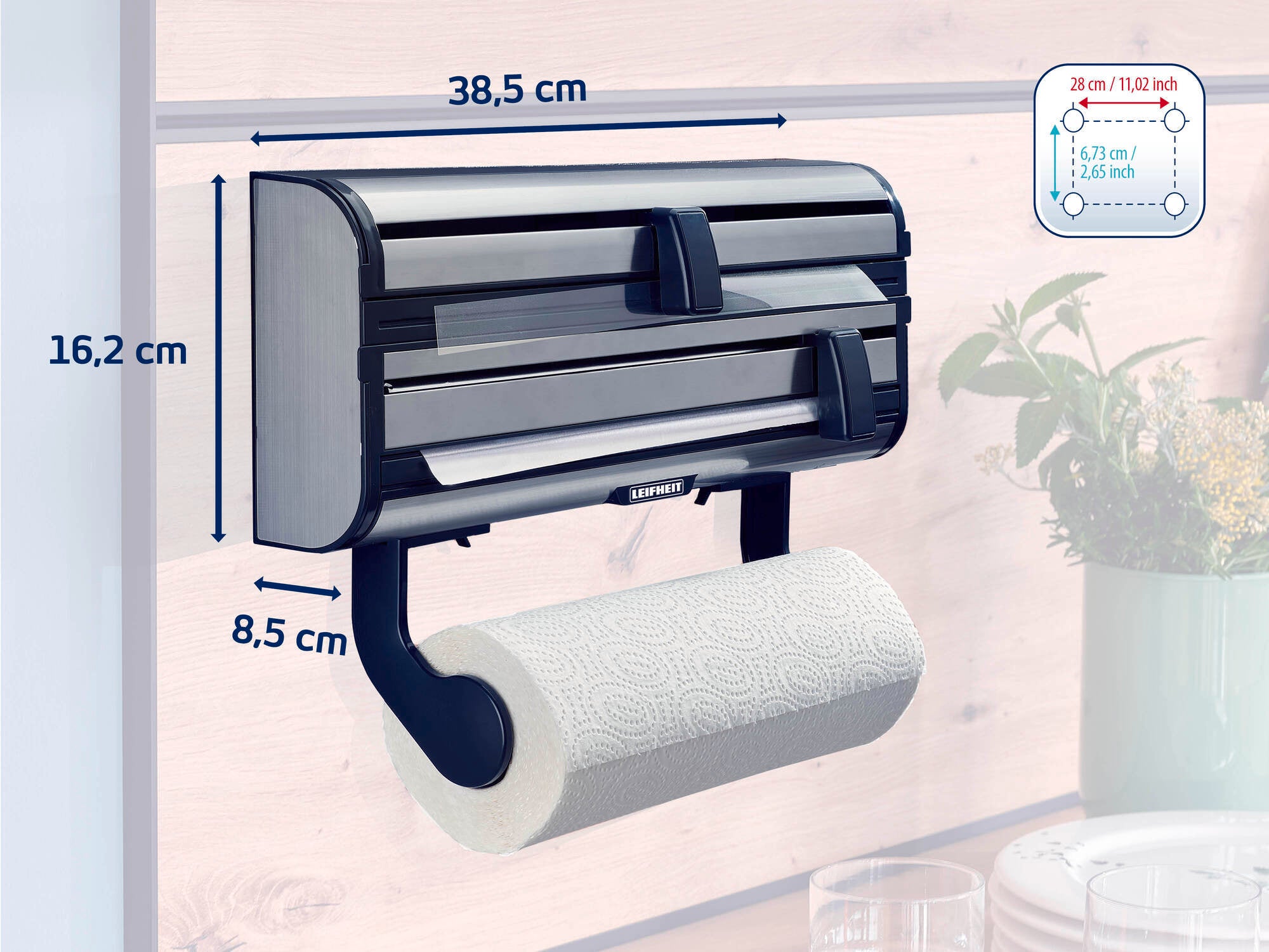 Wall-mounted Leifheit roll holder with three compartments for foil and paper rolls. Dimensions: 38.5 cm wide, 16.2 cm high, 8.5 cm deep. Practical for the kitchen and household.