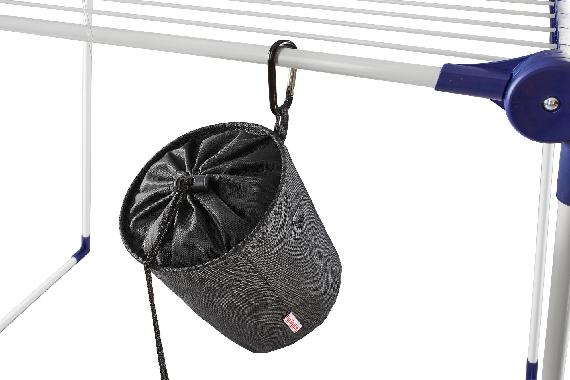 A black clothes peg bag hangs on a clothes horse. The bag is cylindrical and closed with a drawstring. Ideal for storing clothes pegs.