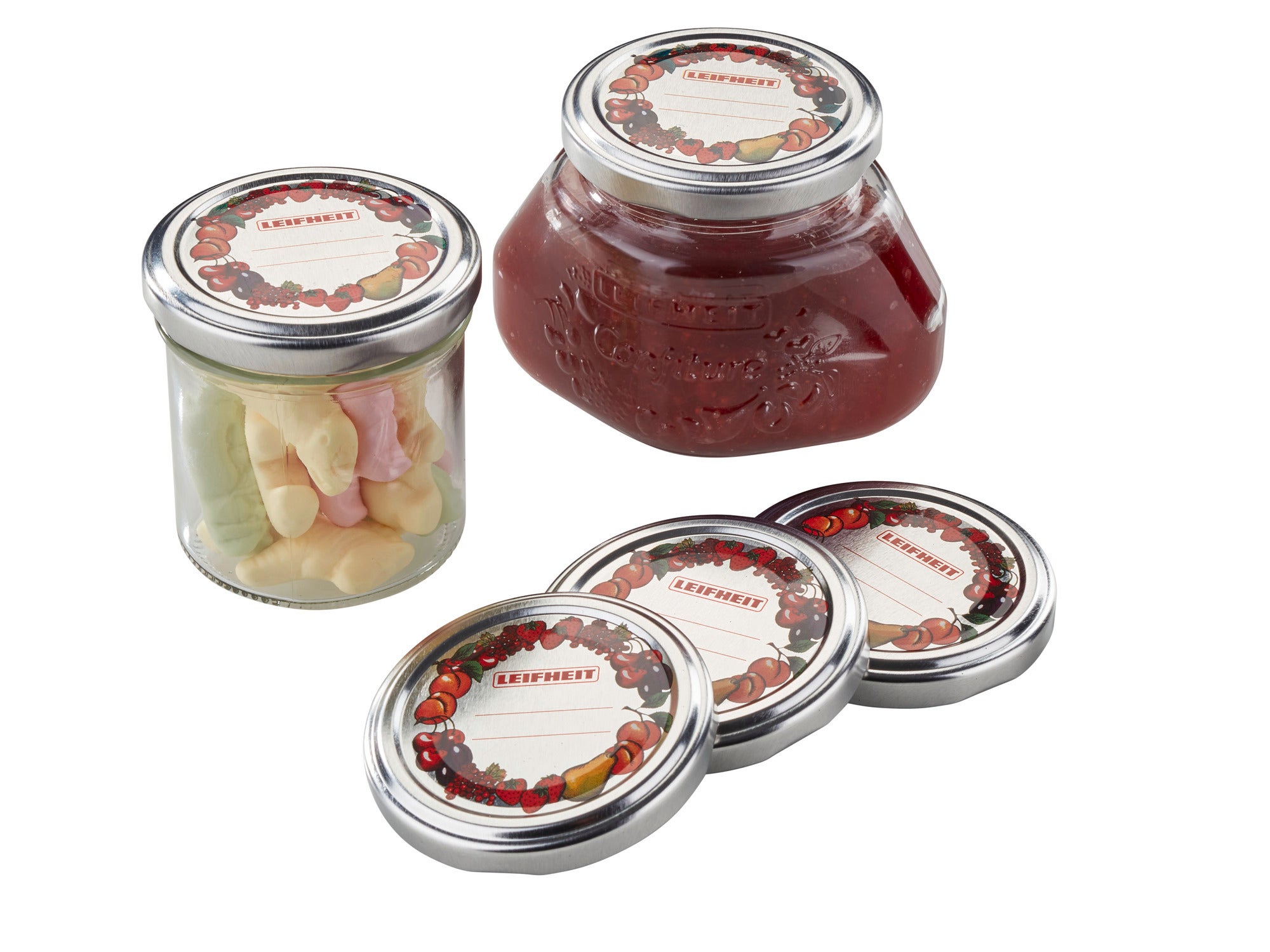 Tapa de repuesto de 66 mm: tres tapas de repuesto plateadas junto a un tarro con frutas rojas y otro con caramelos de colores. Ideal para conservar alimentos.