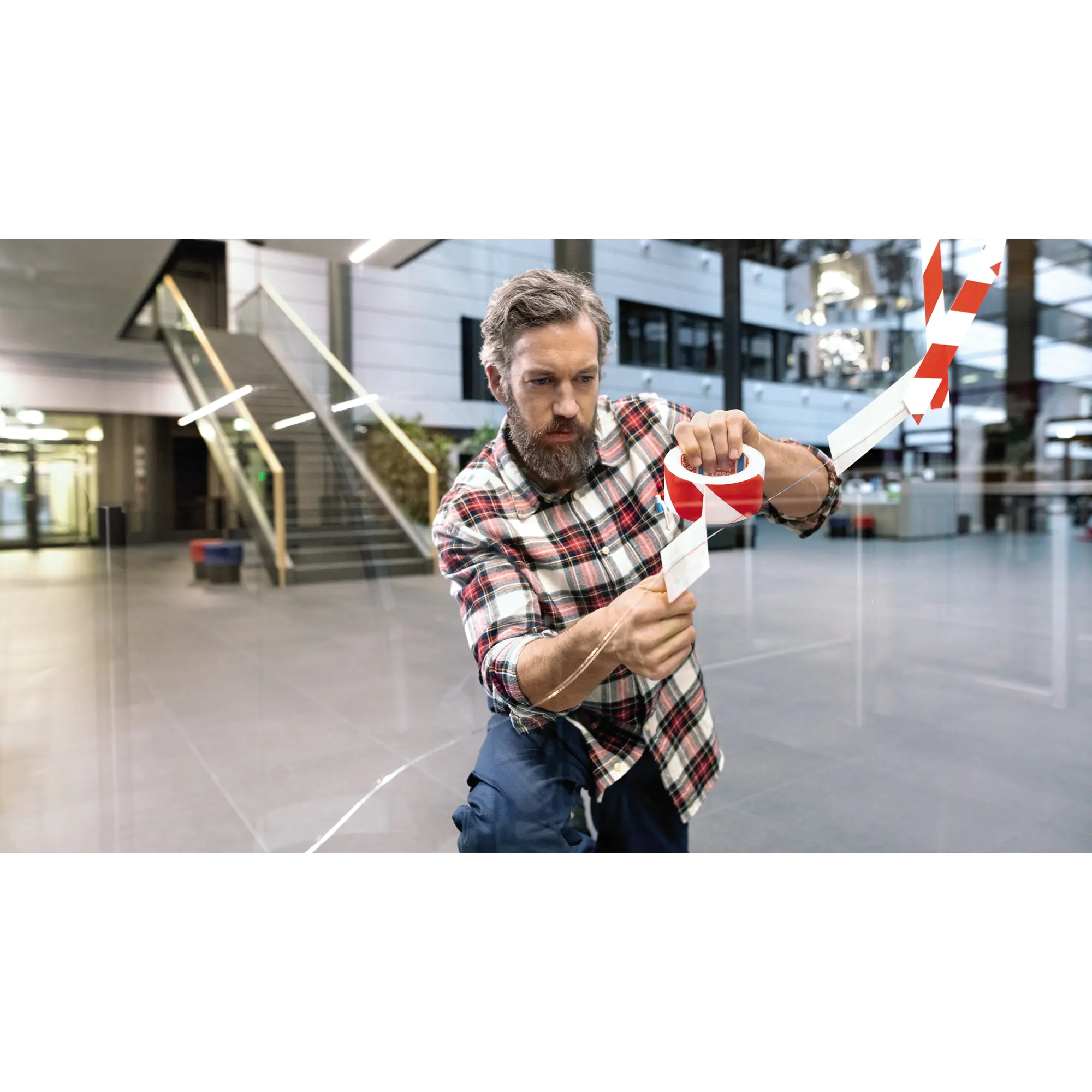 tesa Packband 50mmx66m bedruckt rot weiß aus der Kategorie Kleber & Befestigung