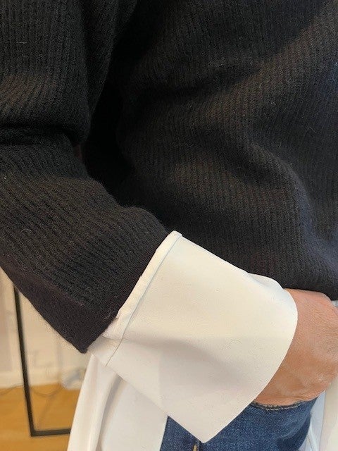 white cuff, long sleeve, black knit, layered sleeve, jeans